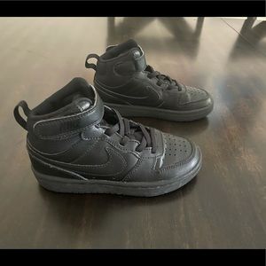 Kids black Nike sneakers